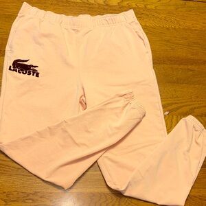 Lacoste medium light orange Joggers with velvet crimson logo